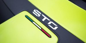 Close-up of Lamborghini Huracan STO with vibrant lime color and sleek design.