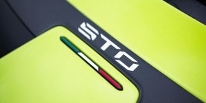 Close-up of Lamborghini Huracan STO with vibrant lime color and sleek design.